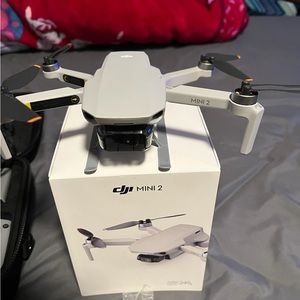 This is a Dji mini 2 drone with a camera that fly up to 6.2 miles and